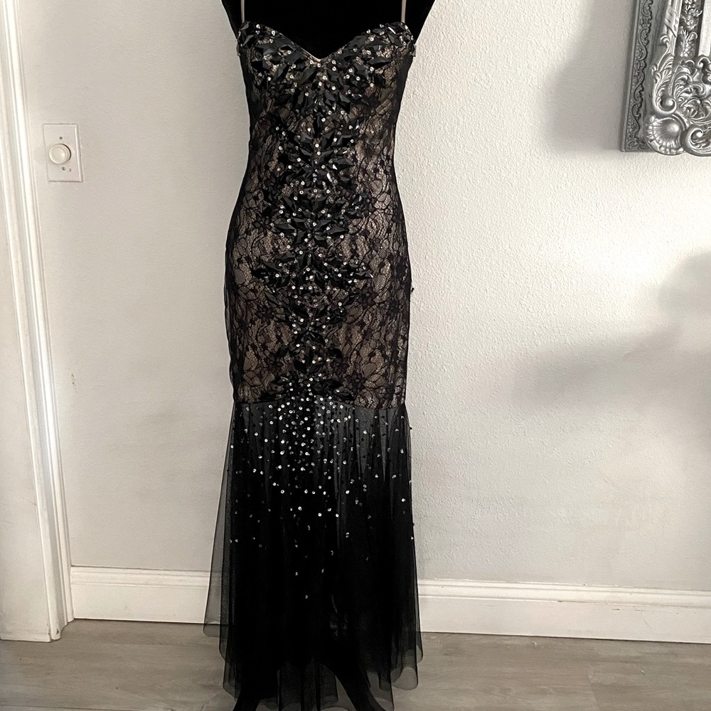 Long black sparklingly dress.